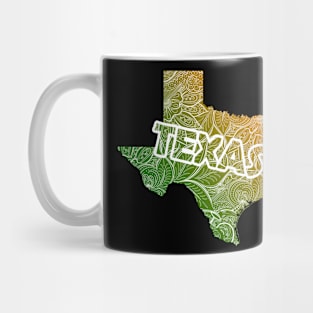 Colorful mandala art map of Texas with text in green and orange Mug